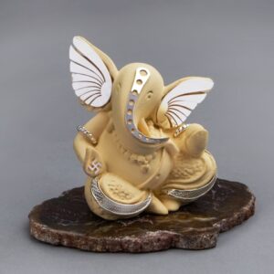 Ivory Ganesha on Petrified Stone